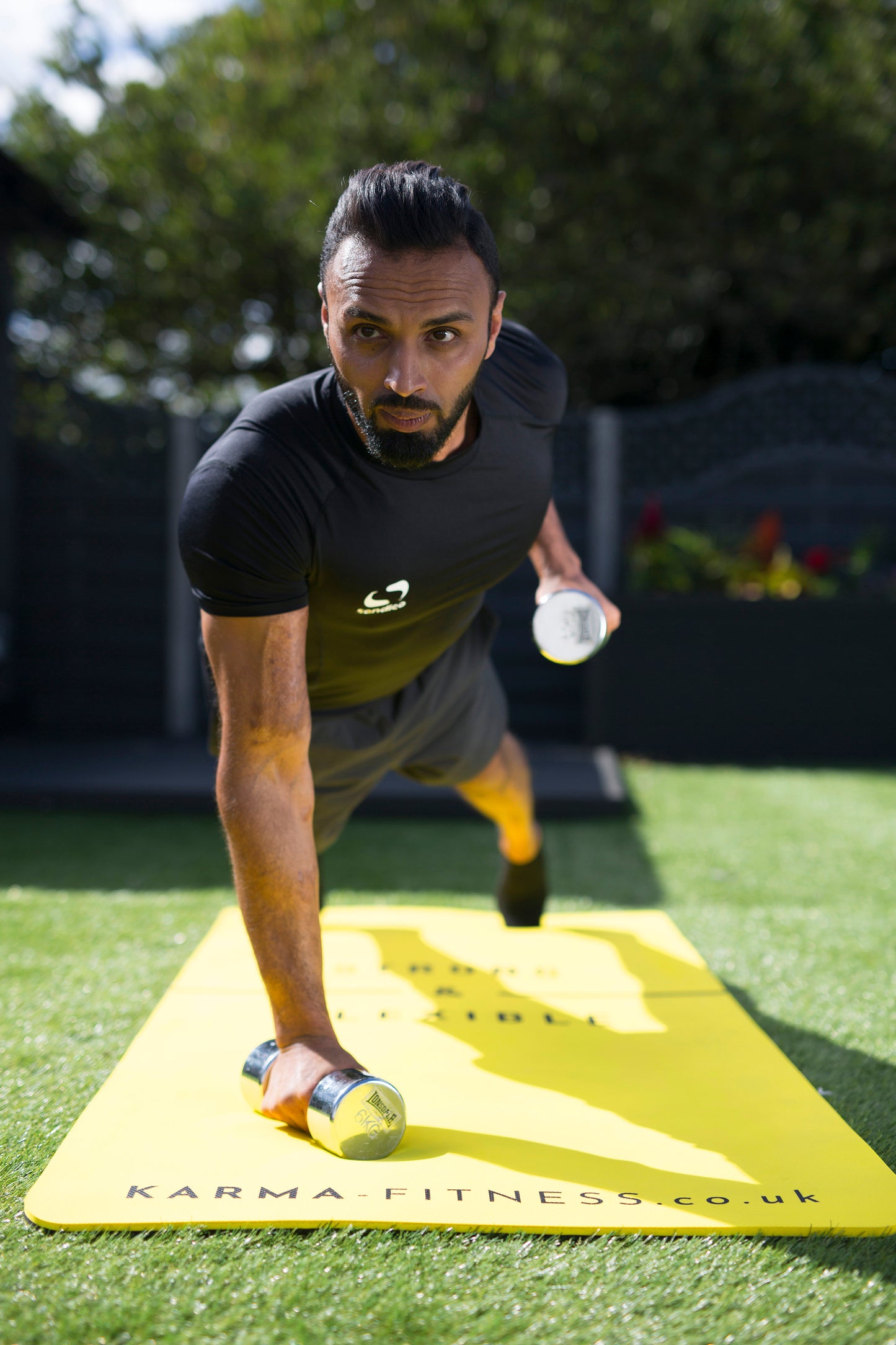 Durable workout mat with dumbbells