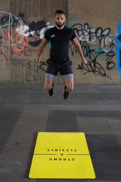 Jumping on large exercise mat